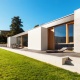 modern home with grass lawn
